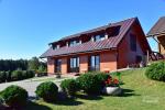 Guest house in Trakai PANORAMA – rooms, suites, sauna, yard with a view to Trakai castle