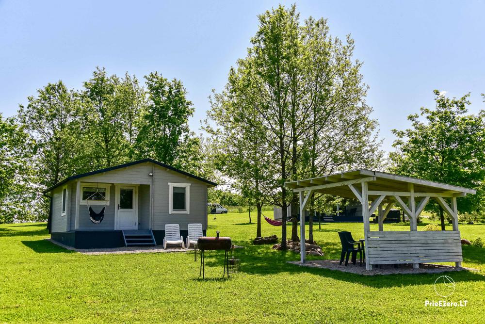 Holiday Cottages by Lake Sausvingis and Homestead on the shore of the lake in Pivašiūnai - 1