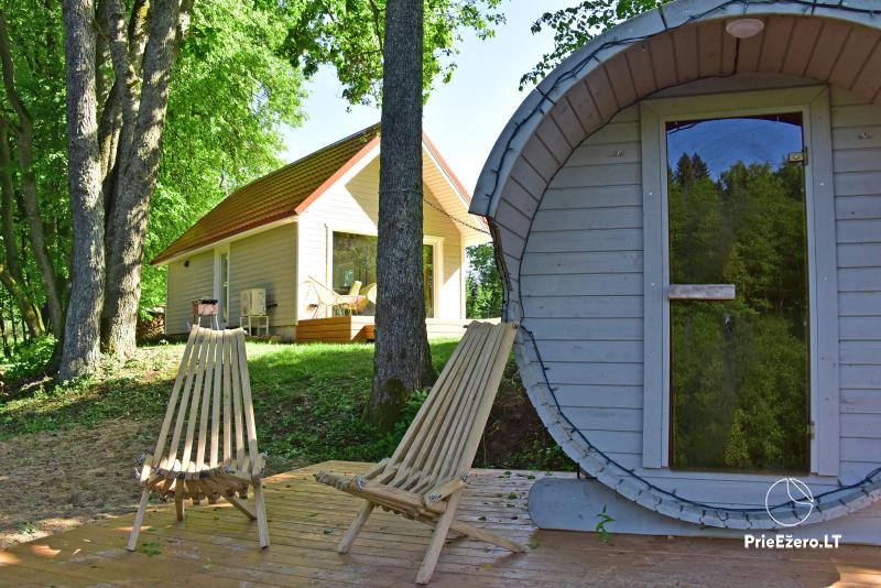 New holiday cottage for rent on the shore of the lake Kiauklių Oazė. There is a sauna, a hot tub