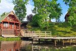 Holiday cottages in a homestead on the lake shore LAKE VIEW RESORT. Sauna, hot tub