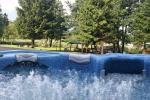 Sauna and outdoor Jacuzzi in homestead "Siesarties Bebrynė" in Moletai district at the lake Siesartis